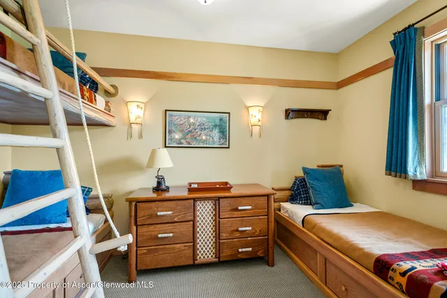 a room with pool table and a rug