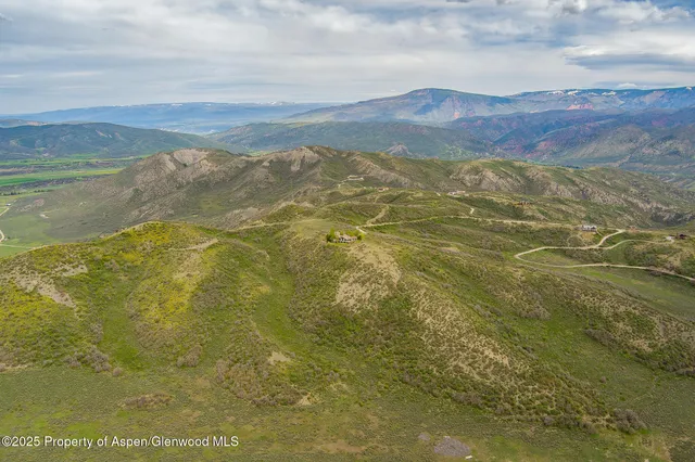 a view of an ocean and mountain