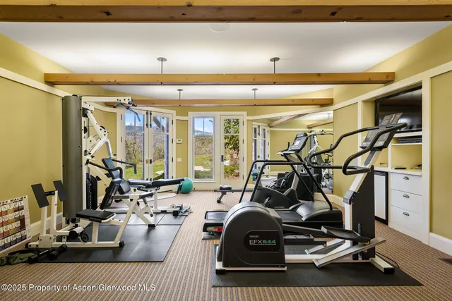 a view of a chairs and table in patio