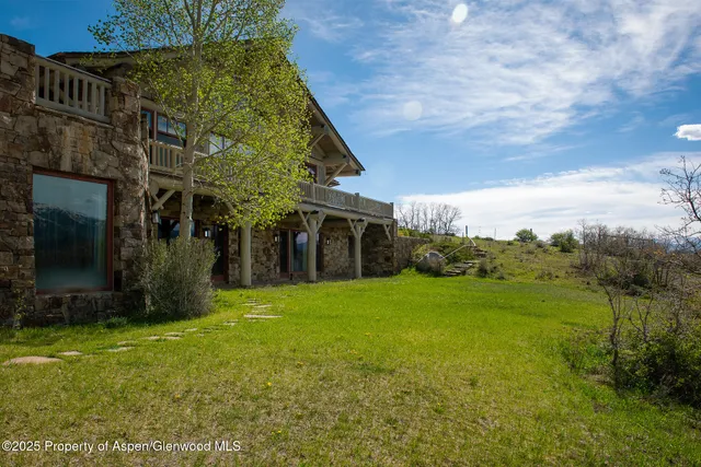 a view of a city with lush green forest