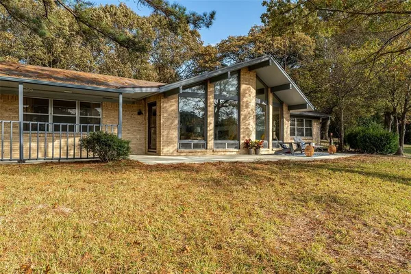 front view of a house with a swimming pool