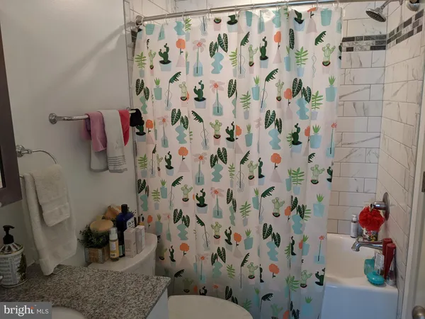 a bathroom with a shower curtain