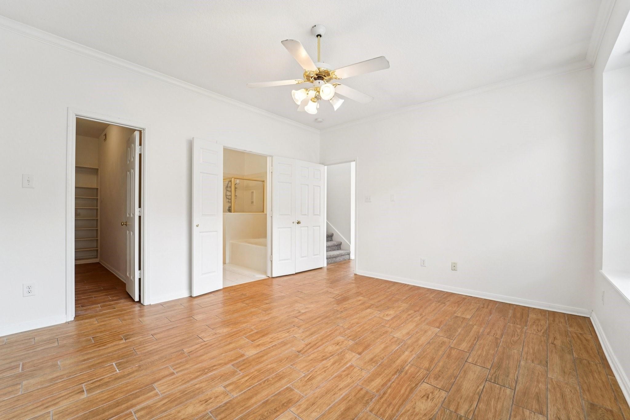 14420 Walters Road, Unit 55 Houston, TX 77014 - Photo 22 of 35 a view of an empty room with wooden floor