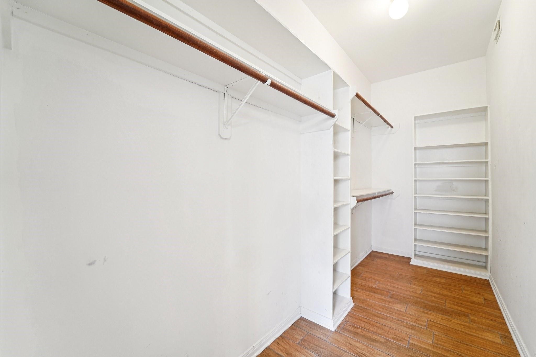 14420 Walters Road, Unit 55 Houston, TX 77014 - Photo 23 of 35 a view of walk in closet with empty racks