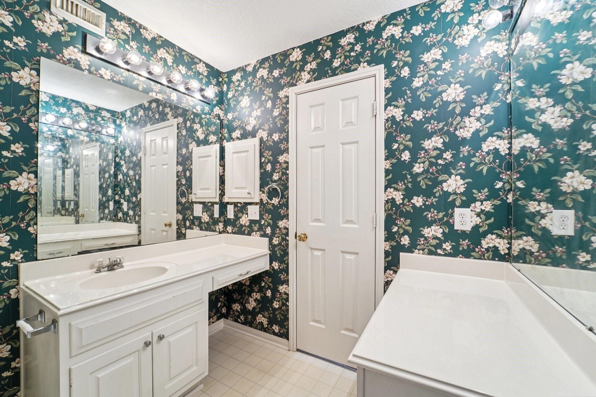 14420 Walters Road, Unit 55 Houston, TX 77014 - Photo 30 of 35 a bathroom with a sink and a mirror