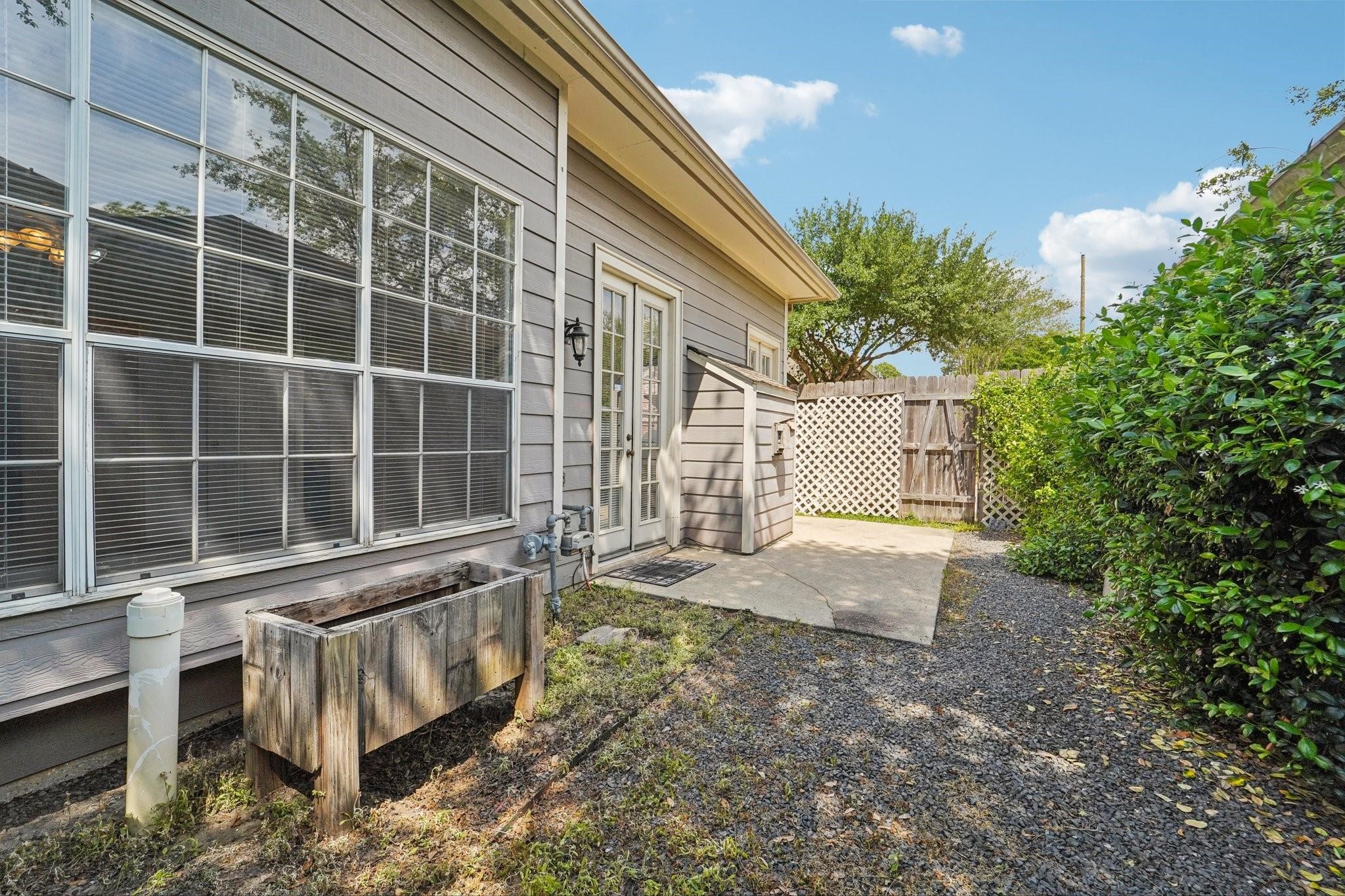 14420 Walters Road, Unit 55 Houston, TX 77014 - Photo 34 of 35 a view of a backyard with a large tree
