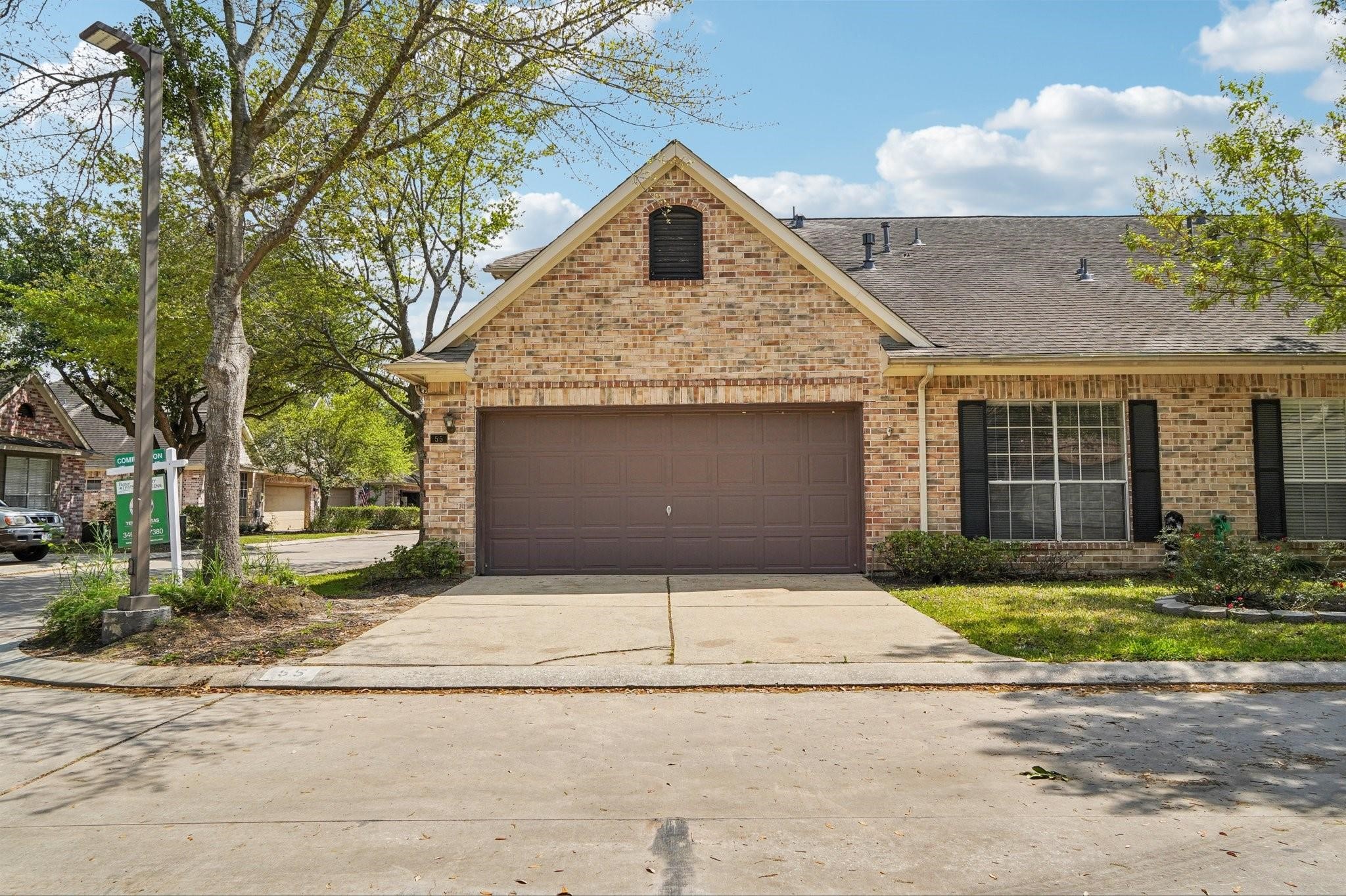 14420 Walters Road, Unit 55 Houston, TX 77014 - Photo 35 of 35 a front view of a house with a yard and garage