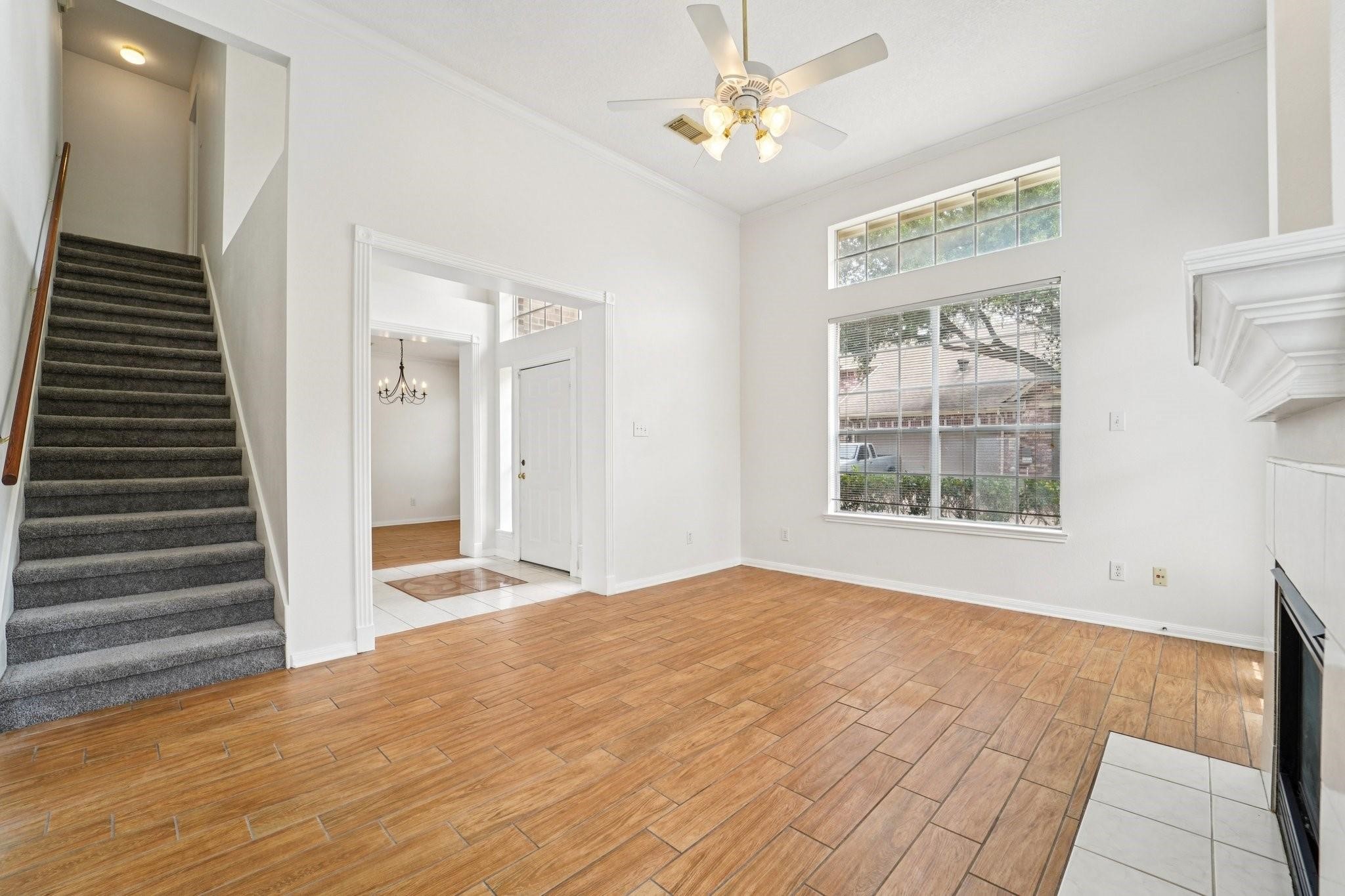 14420 Walters Road, Unit 55 Houston, TX 77014 - Photo 5 of 35 a view of an empty room with wooden floor and a window