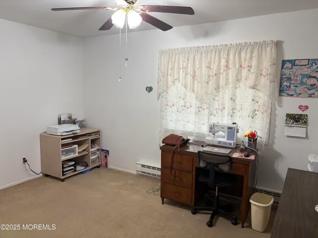 a room with furniture and musical instruments