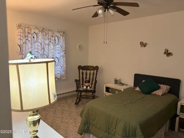 a bedroom with a bed and a mirror