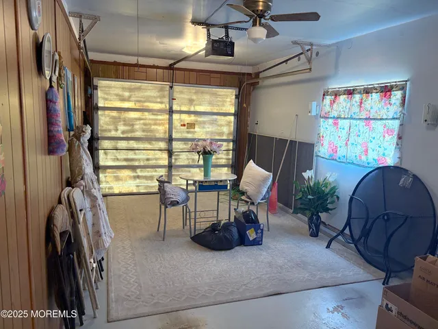 a view of a livingroom with furniture and a window