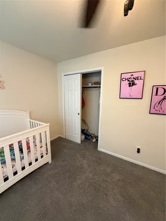 a view of a storage and utility room with washer and dryer