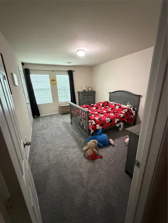 a view of a livingroom with furniture and staircase