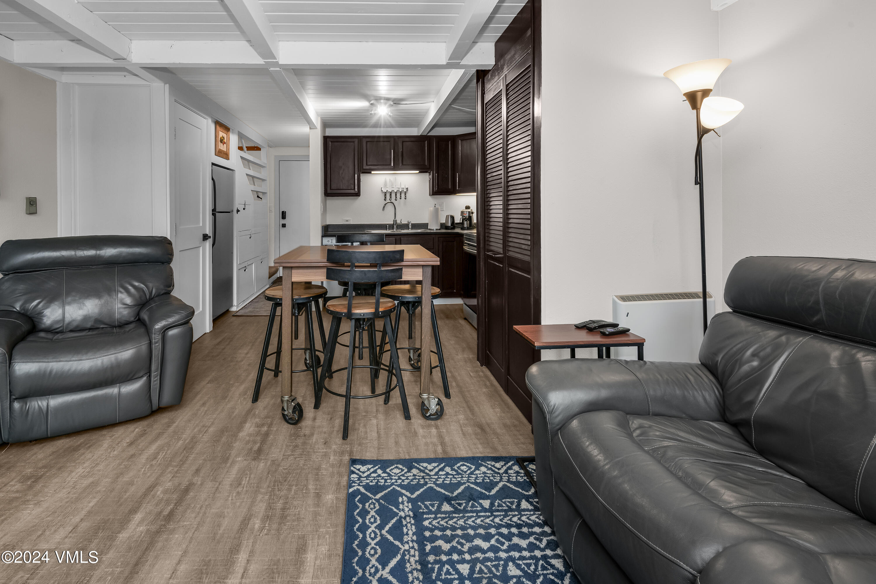 1081 Vail View Drive, Unit B208 Vail, CO 81657 - Photo 2 of 22 a living room with furniture and wooden floor