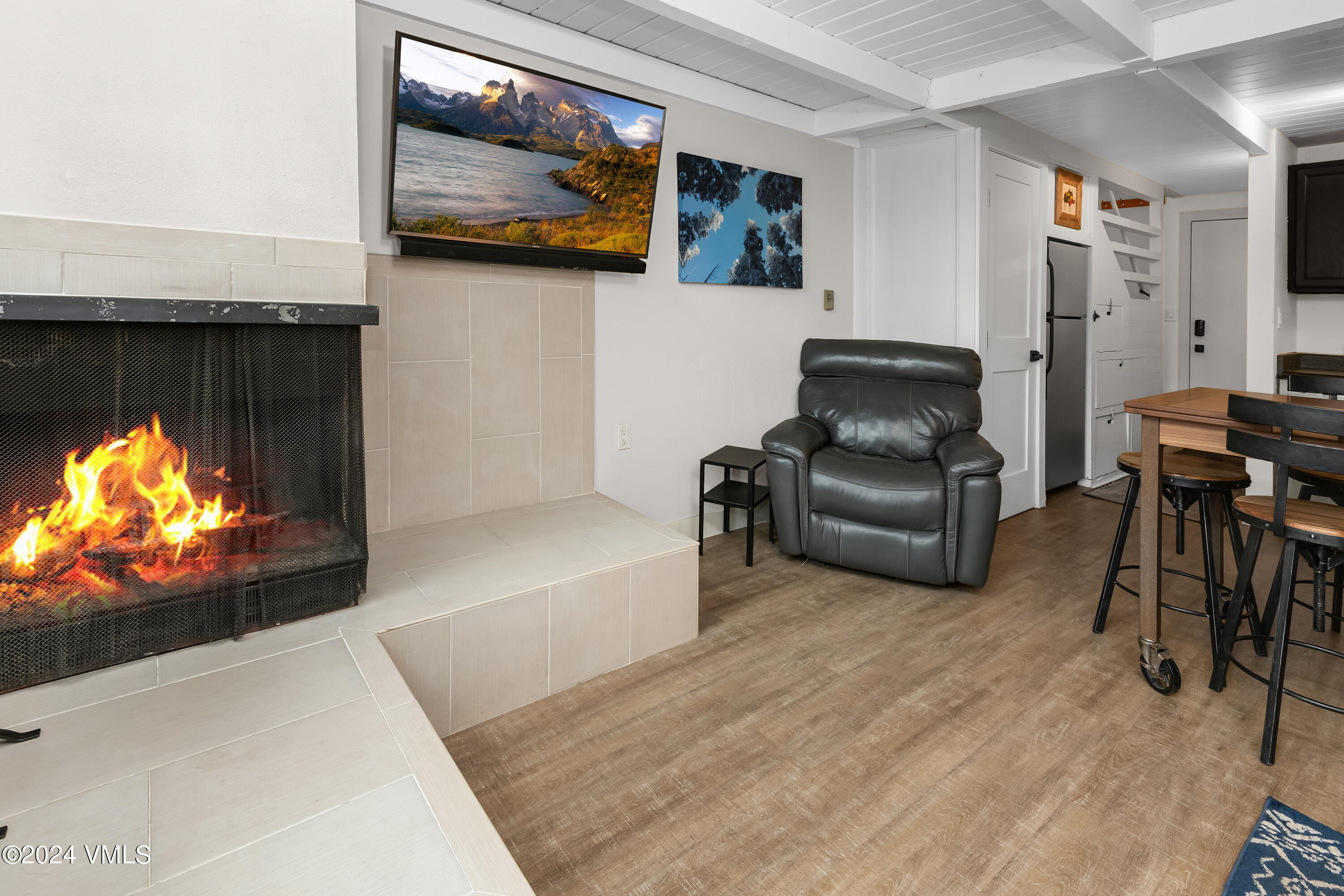 1081 Vail View Drive, Unit B208 Vail, CO 81657 - Photo 3 of 22 a living room with furniture and a flat screen tv