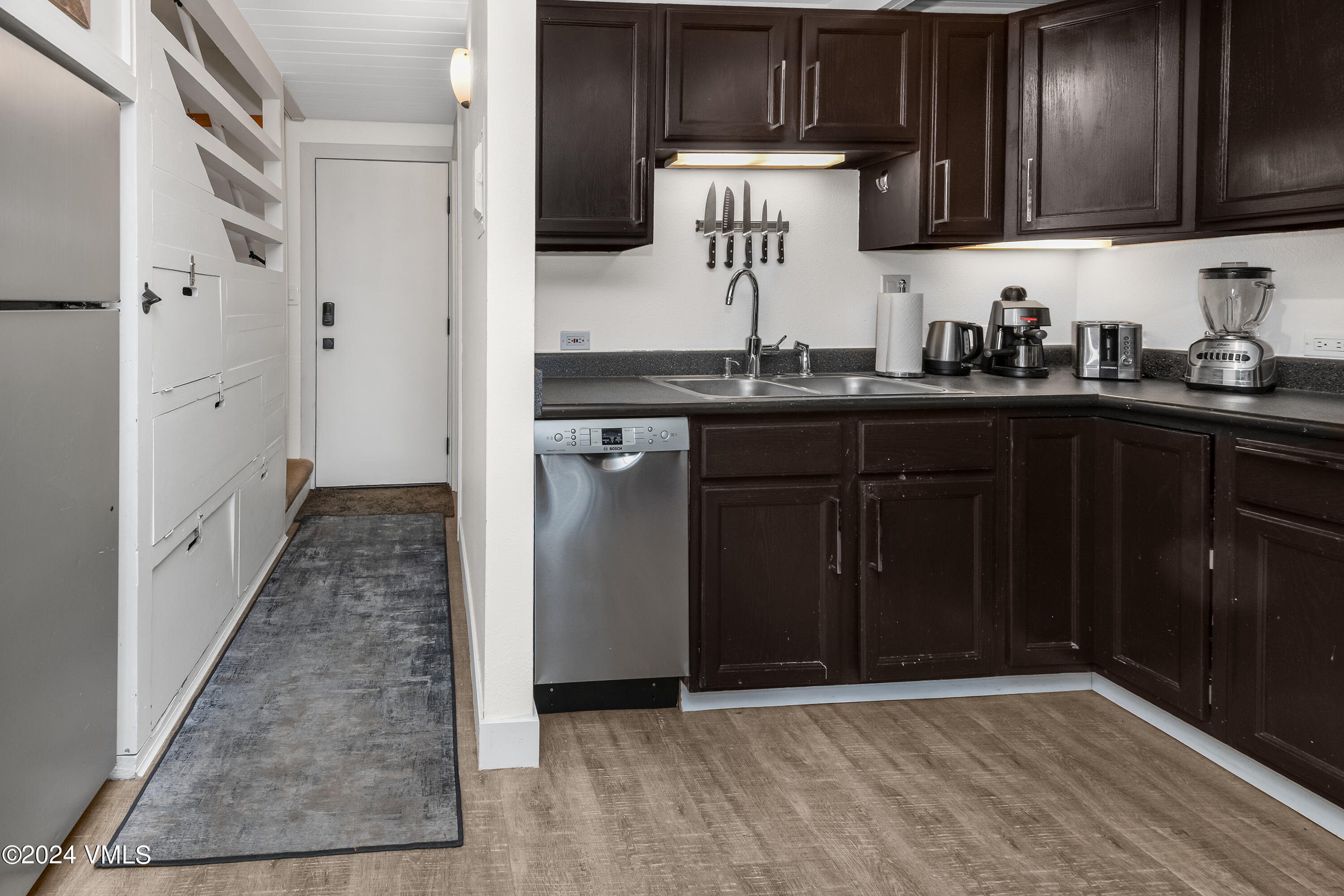 1081 Vail View Drive, Unit B208 Vail, CO 81657 - Photo 6 of 22 a kitchen with stainless steel appliances granite countertop a refrigerator and a sink