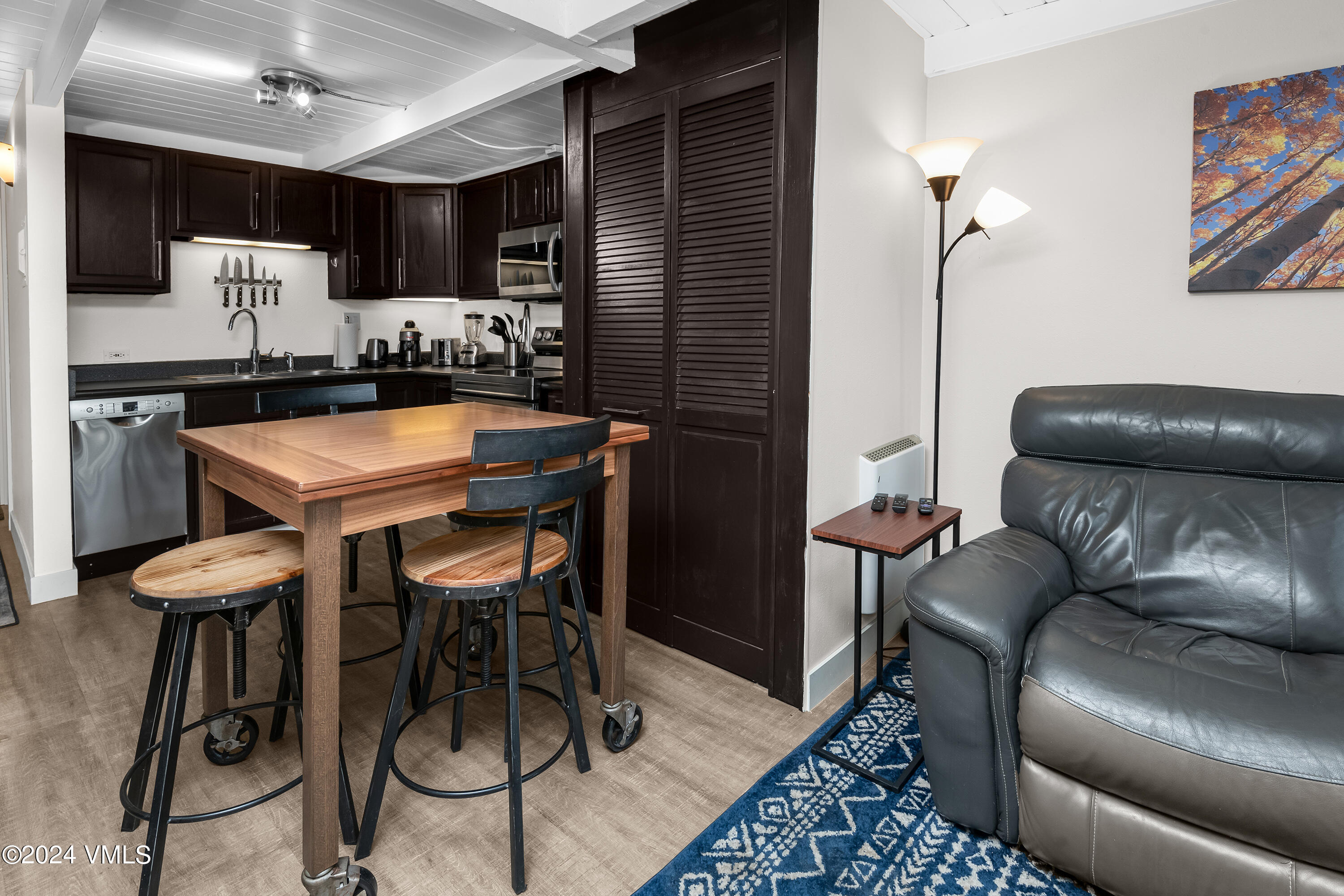 1081 Vail View Drive, Unit B208 Vail, CO 81657 - Photo 7 of 22 a dining room with furniture and kitchen view