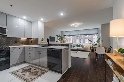 a open kitchen with sink cabinets and stainless steel appliances