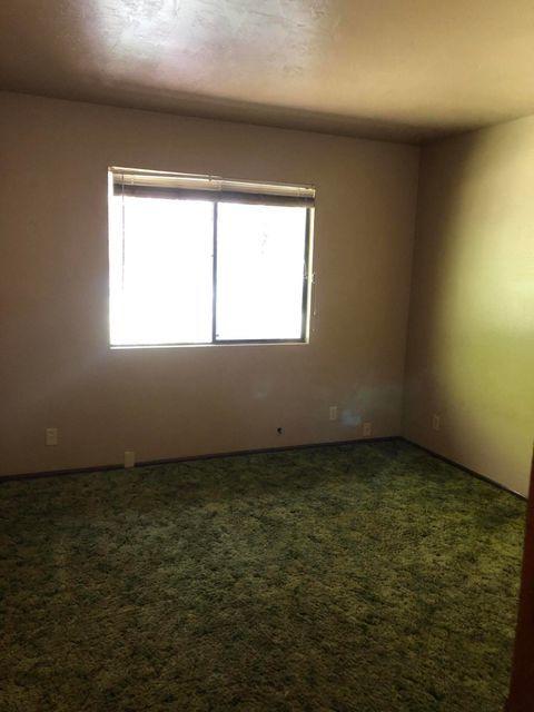 922 Garner Road Cave Junction, OR 97523 - Photo 16 of 24 an empty room with a window