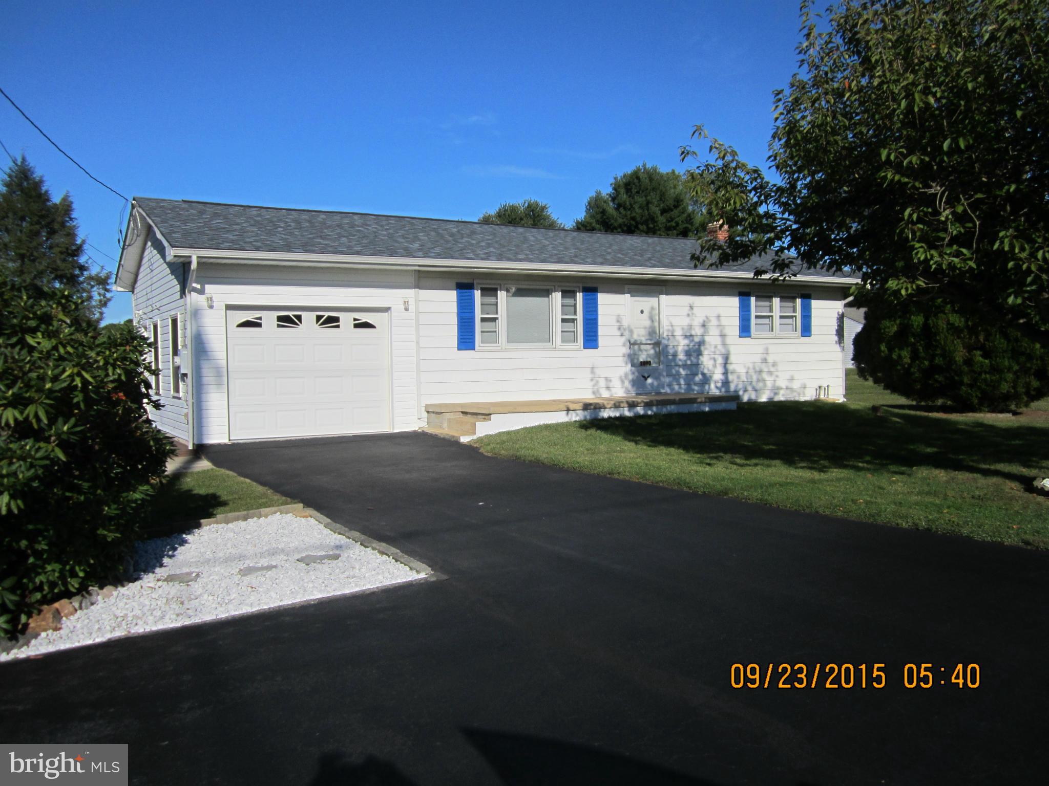 2890 Singerly Road Elkton, MD 21921 - Photo 1 of 28 a front view of a house with a yard and garage