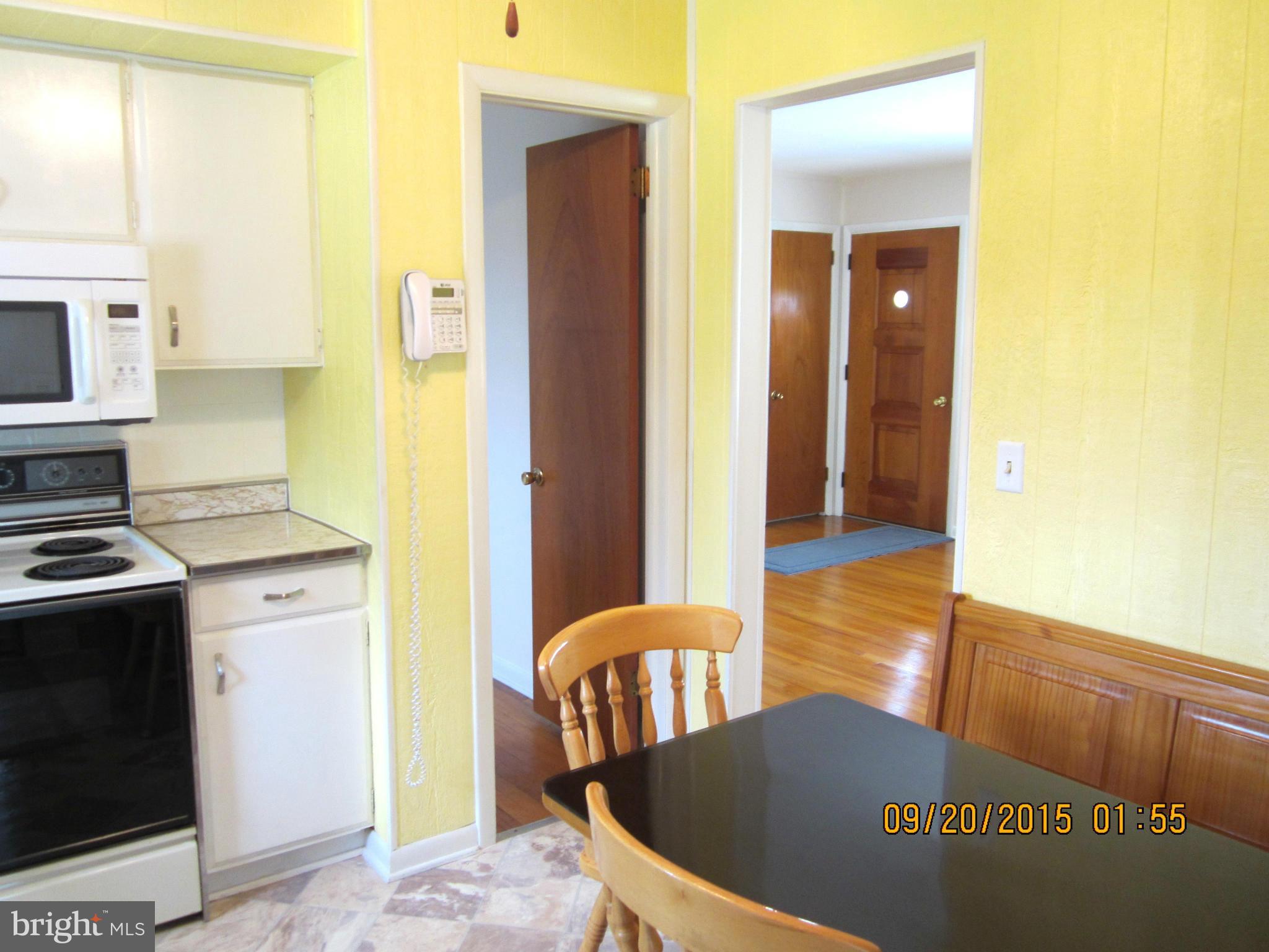 2890 Singerly Road Elkton, MD 21921 - Photo 13 of 28 a view of a kitchen with dining area a sink and a refrigerator