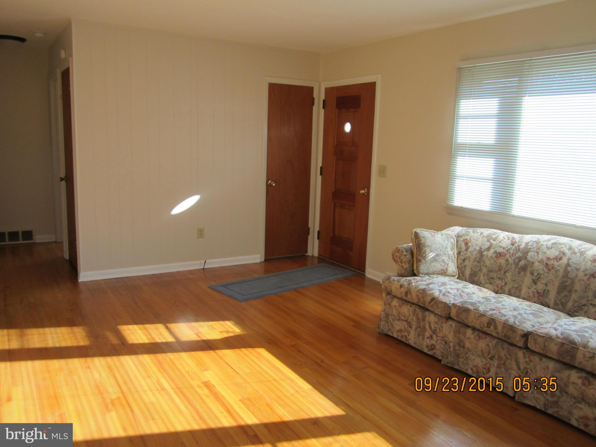 2890 Singerly Road Elkton, MD 21921 - Photo 8 of 28 a living room with a couch and a coffee table