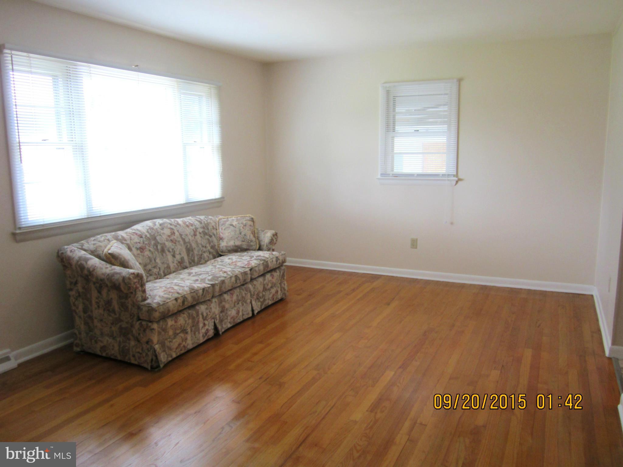 2890 Singerly Road Elkton, MD 21921 - Photo 10 of 28 a living room with a couch and a window