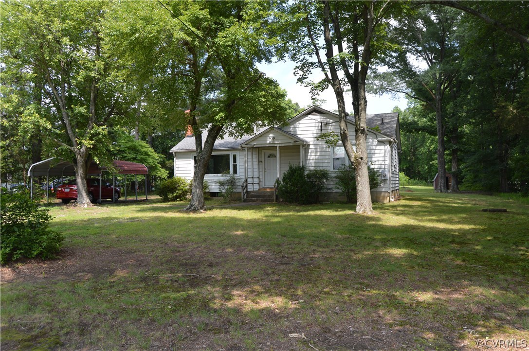 7239 Iron Bridge Road Richmond, VA 23234 - Photo 2 of 17 a front view of a house with a yard