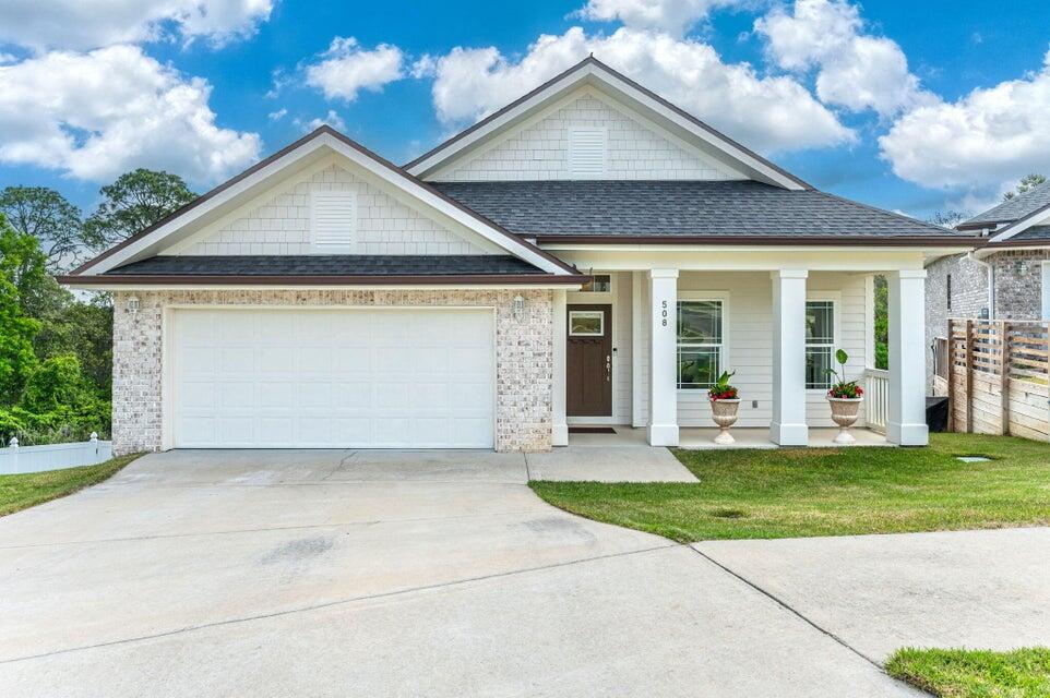508 Harborview Circle Niceville, FL 32578 - Photo 1 of 60 a front view of a house with a yard