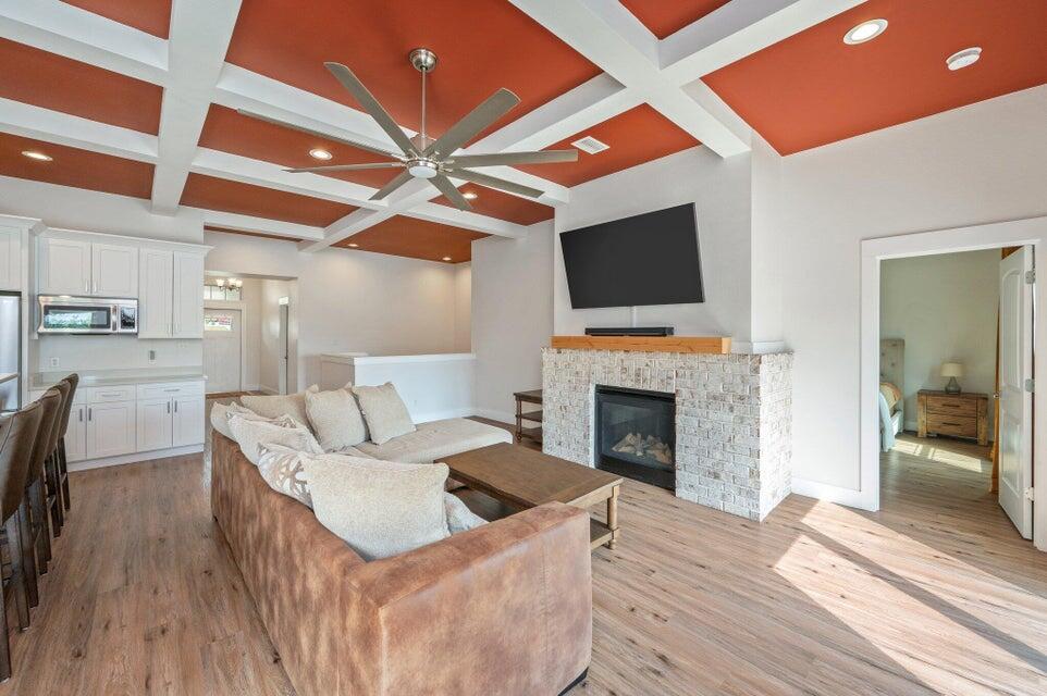 508 Harborview Circle Niceville, FL 32578 - Photo 11 of 60 a living room with furniture a fireplace and a flat screen tv