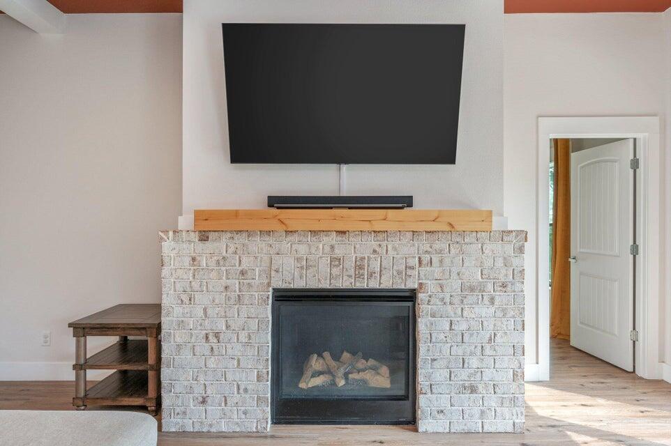 508 Harborview Circle Niceville, FL 32578 - Photo 12 of 60 a living room with a fireplace and a flat screen tv
