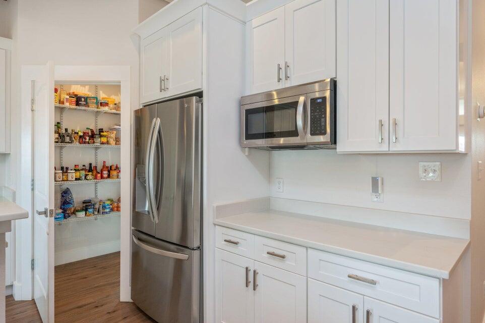 508 Harborview Circle Niceville, FL 32578 - Photo 19 of 60 a kitchen with stainless steel appliances white cabinets and a refrigerator