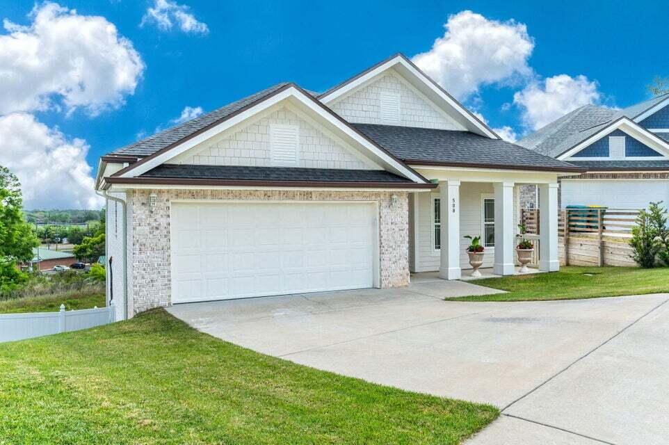 508 Harborview Circle Niceville, FL 32578 - Photo 2 of 60 a front view of a house with garden