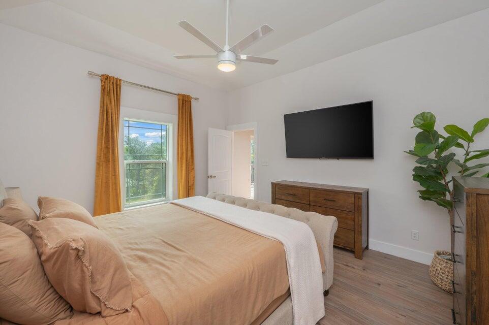 508 Harborview Circle Niceville, FL 32578 - Photo 22 of 60 a bedroom with a bed and a flat screen tv