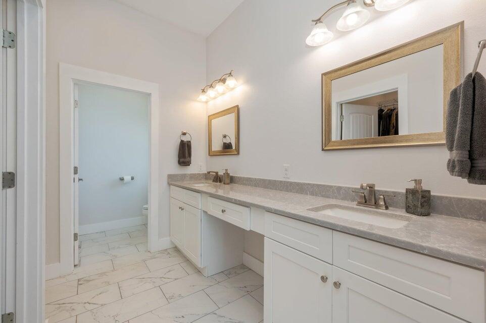 508 Harborview Circle Niceville, FL 32578 - Photo 23 of 60 a bathroom with a granite countertop sink mirror and