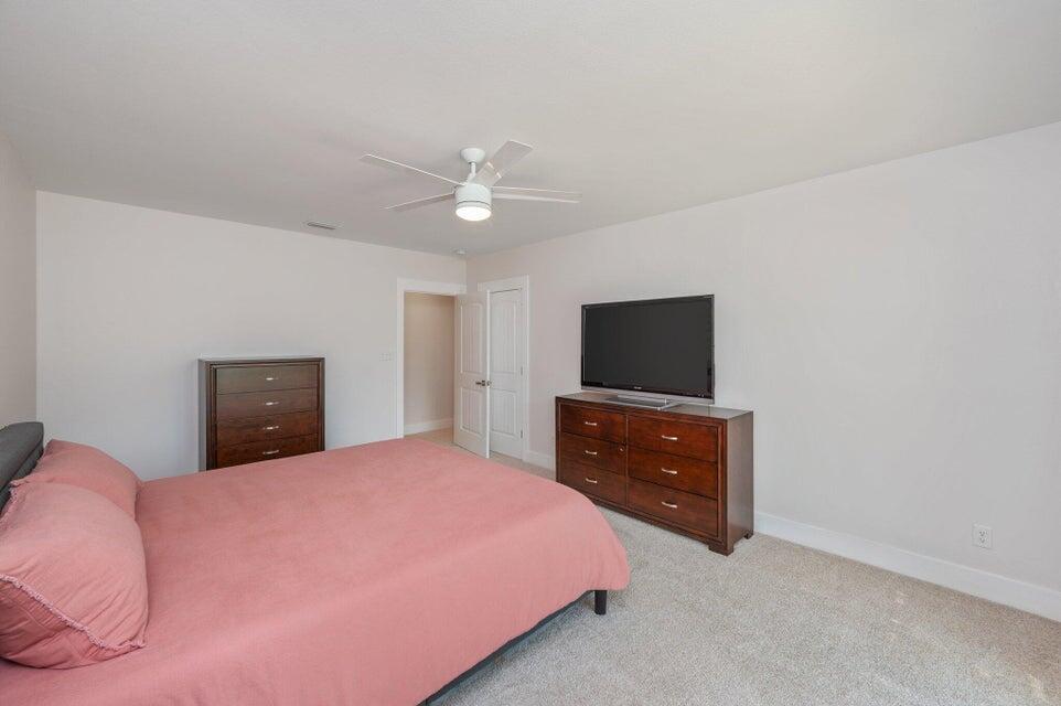 508 Harborview Circle Niceville, FL 32578 - Photo 48 of 60 a bedroom with a bed and a flat screen tv