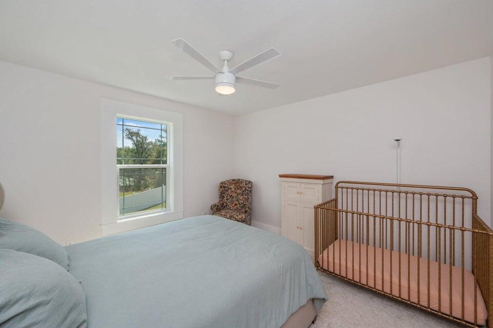508 Harborview Circle Niceville, FL 32578 - Photo 49 of 60 a bedroom with a bed and a window