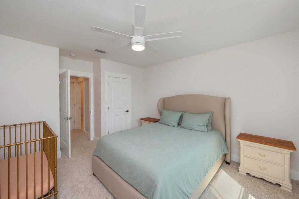 508 Harborview Circle Niceville, FL 32578 - Photo 50 of 60 a bedroom with a bed and a dresser