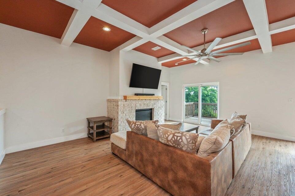 508 Harborview Circle Niceville, FL 32578 - Photo 8 of 60 a living room with furniture a fireplace and a flat screen tv