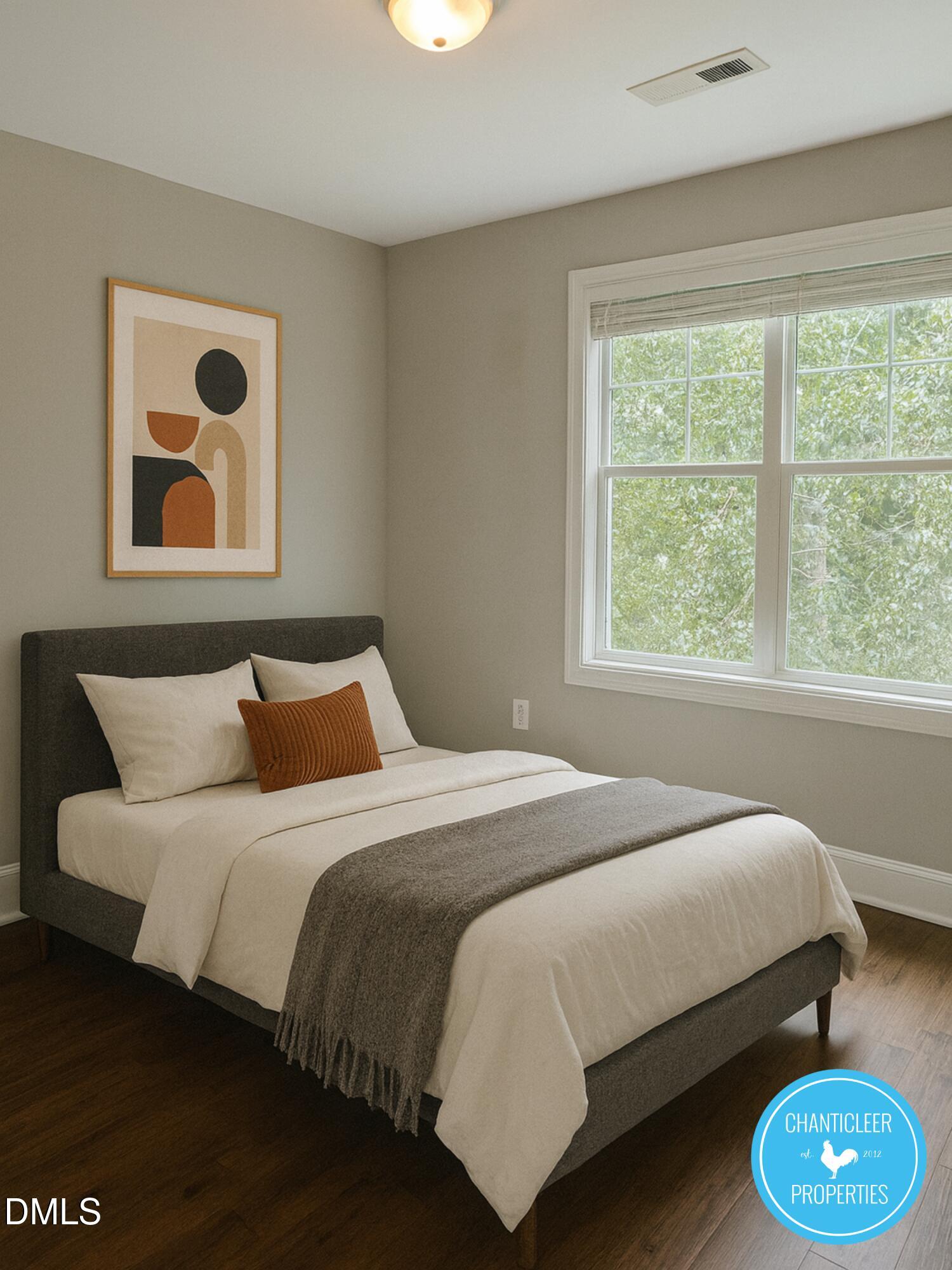 912 Chaney Road, Unit 100 Raleigh, NC 27606 - Photo 14 of 18 a bedroom with a bed and a large window