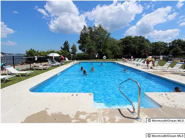 25 Buckingham Road Brick, NJ 08723 - Photo 8 of 11 a view of a swimming pool with an outdoor seating