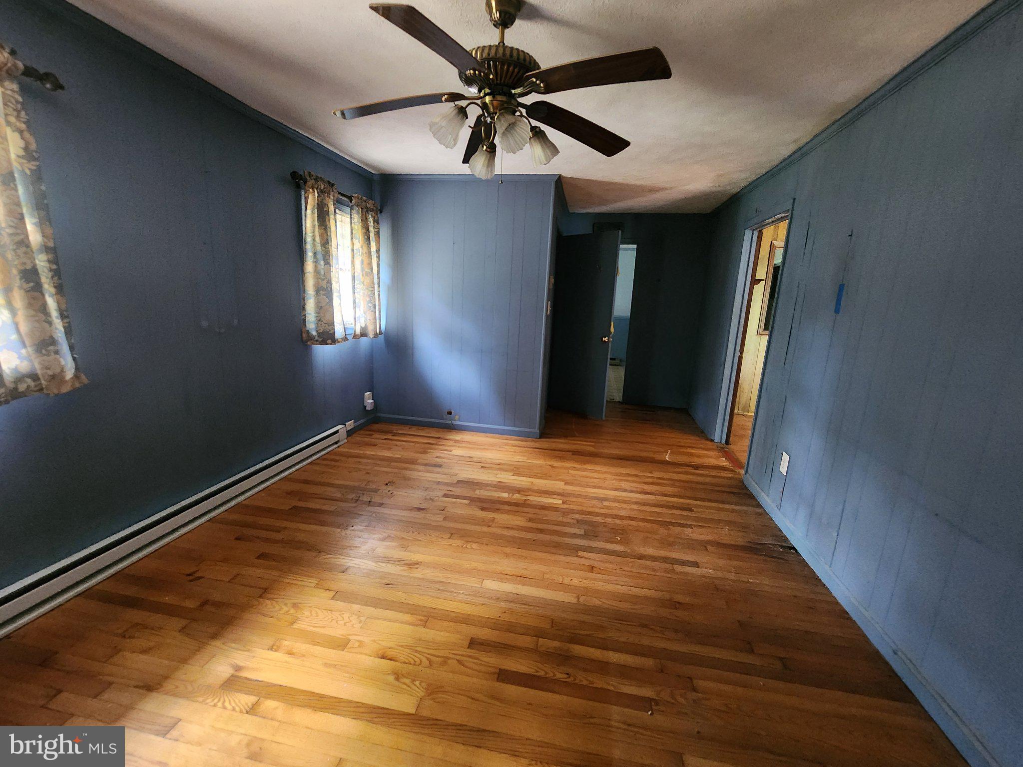 5361 Balls Mill Road Midland, VA 22728 - Photo 22 of 24 Spacious room with charming blue walls.