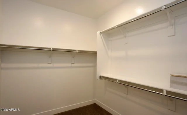 a view of an empty walk in closet