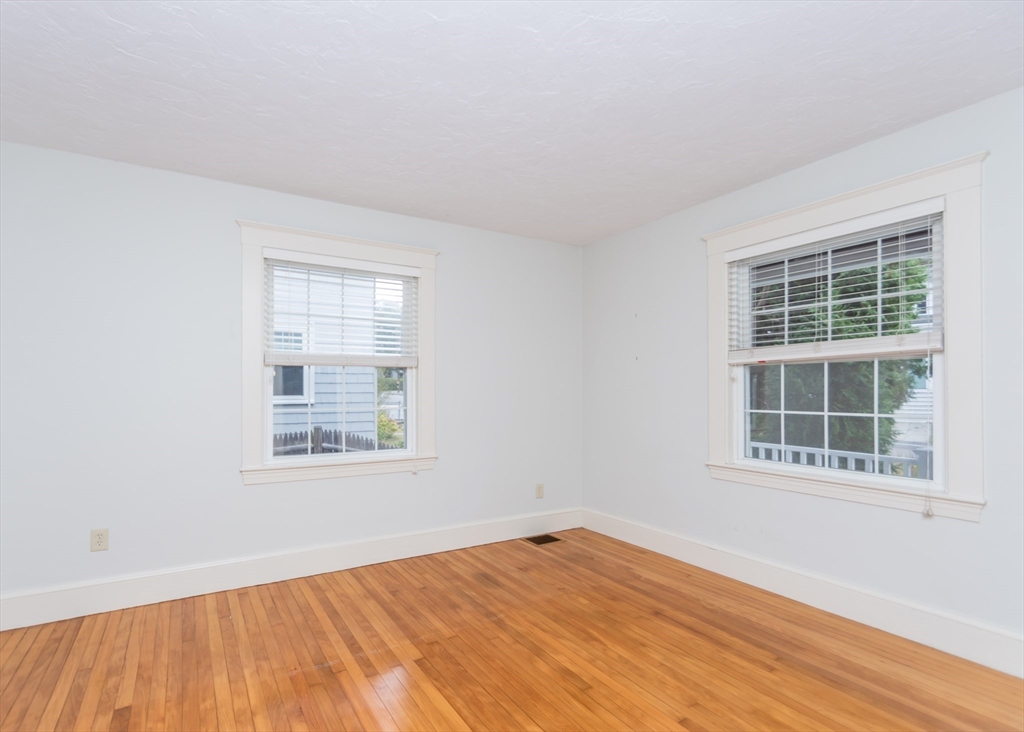 37 Summit Street Waltham, MA 02451 - Photo 11 of 29 an empty room with wooden floor and windows