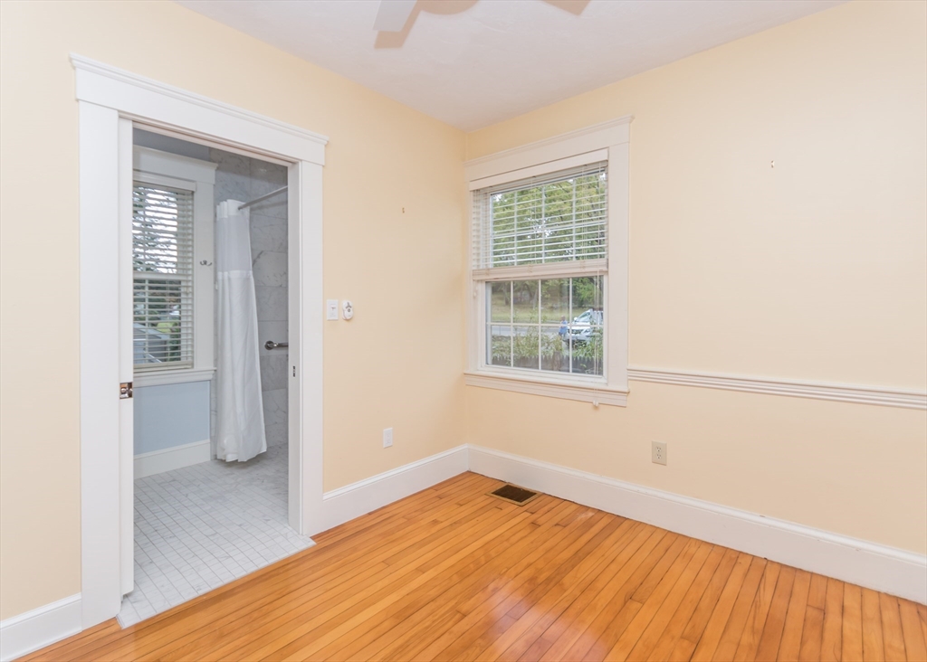 37 Summit Street Waltham, MA 02451 - Photo 14 of 29 an empty room with wooden floor and windows