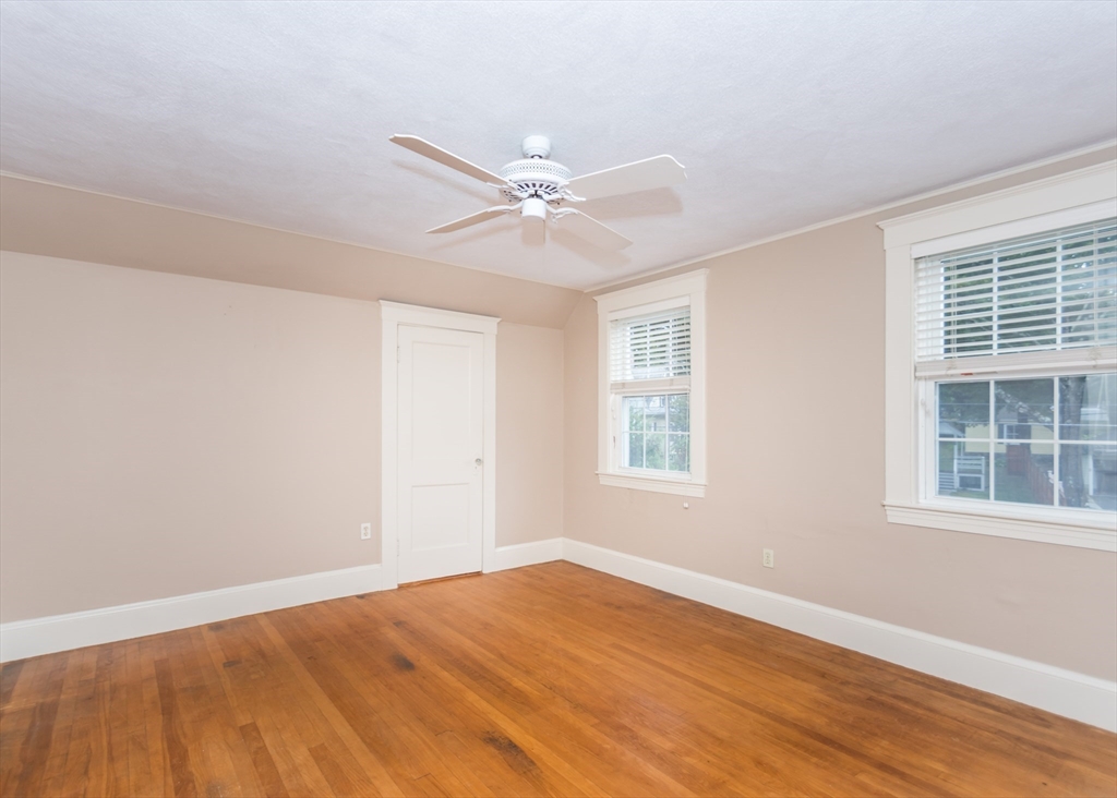 37 Summit Street Waltham, MA 02451 - Photo 16 of 29 a view of an empty room with wooden floor and a window
