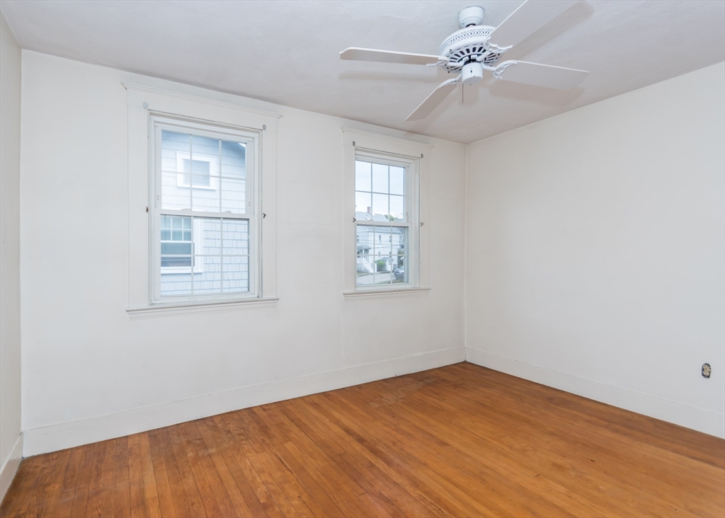 37 Summit Street Waltham, MA 02451 - Photo 18 of 29 wooden floor in an empty room with a window