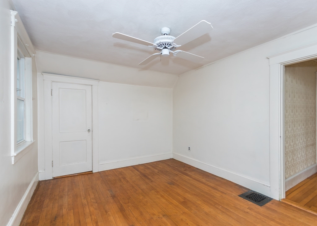 37 Summit Street Waltham, MA 02451 - Photo 20 of 29 a view of an empty room with wooden floor
