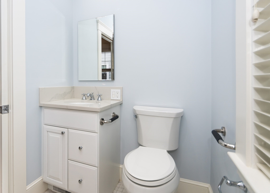37 Summit Street Waltham, MA 02451 - Photo 21 of 29 a white toilet sitting next to a bathroom sink