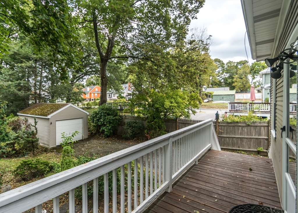 37 Summit Street Waltham, MA 02451 - Photo 25 of 29 a balcony with wooden floor and wooden fence